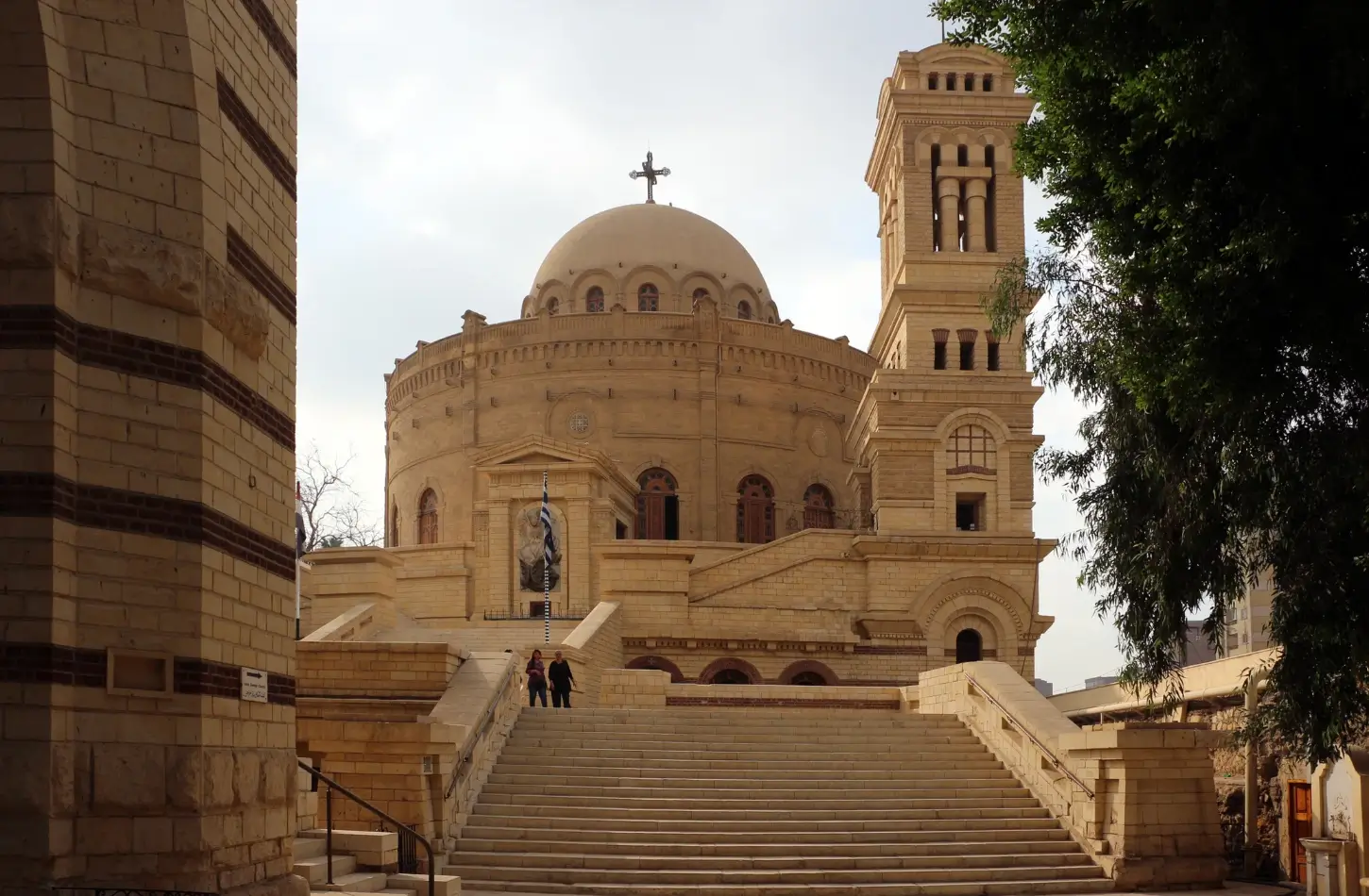 The historic Greek Orthodox Church of St. George (Mari Gerges) in Coptic Cairo, featuring its iconic circular stone rotunda, grand dome, and bell tower, popular for cultural day trips from Marsa Alam